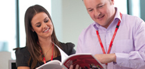 Executives reading about corporate governance