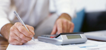 Man using calculator