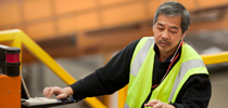 Australia Post employee working at sorting machine