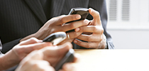 Business people using mobile app