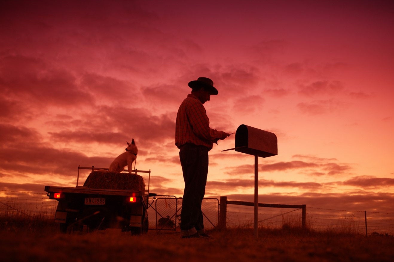 photo-regional-rural-man-getting-mail-from-letterbox-at-sunset