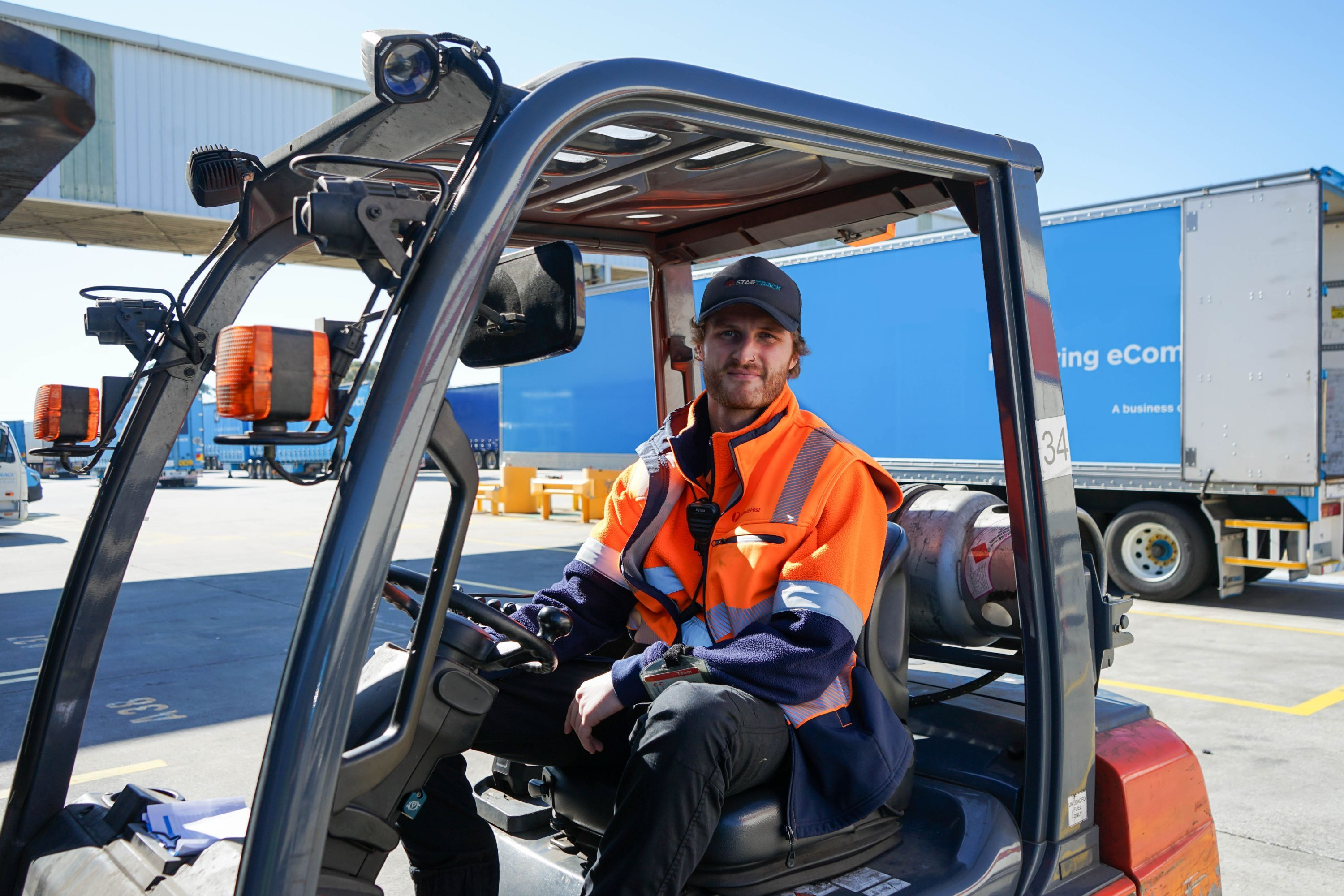 Man on a forklift outside on the oading dock