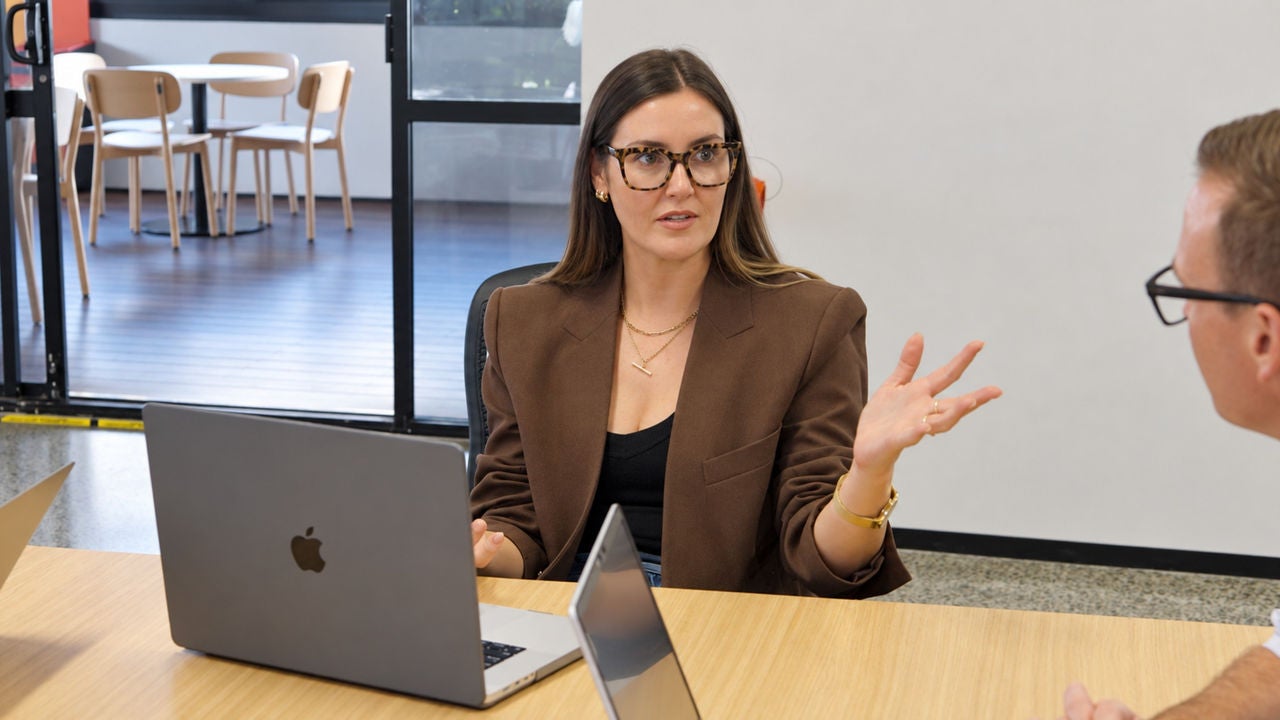Toni Baston, Head of Seller at Woolworths MarketPlus, presenting during a business meeting.