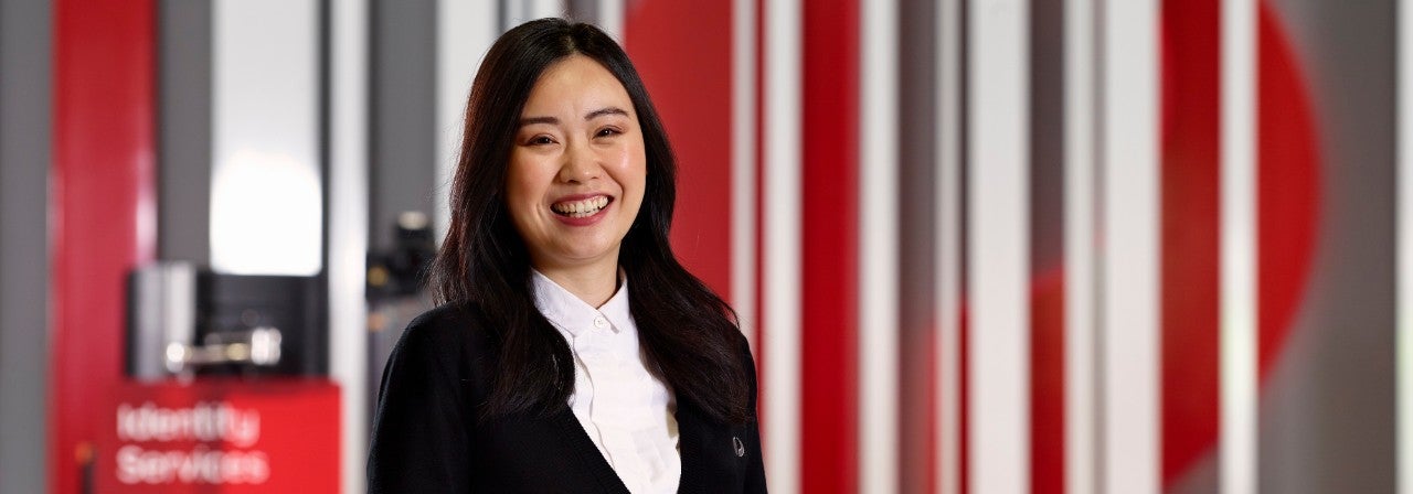 A woman smiling in post office