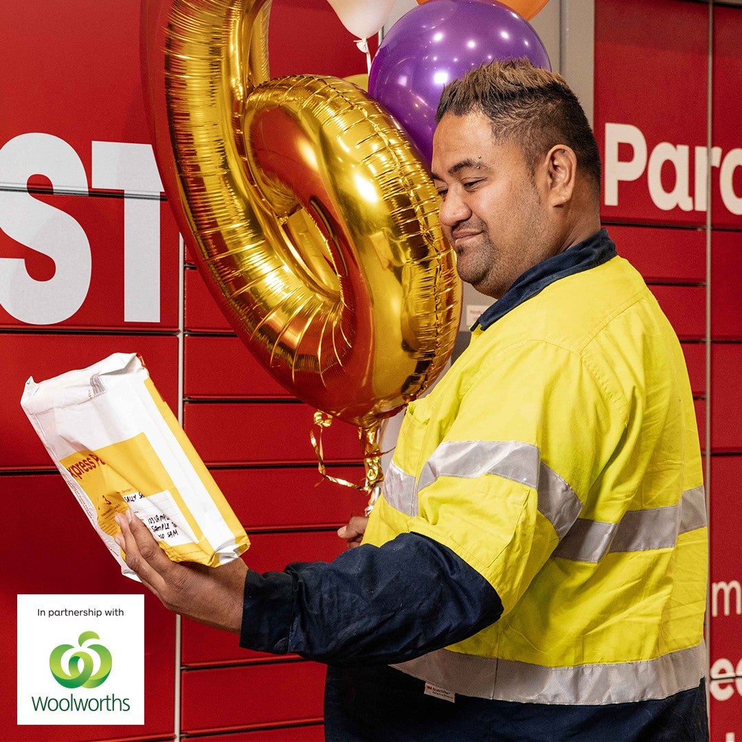 Photo of a man posting into a posting box