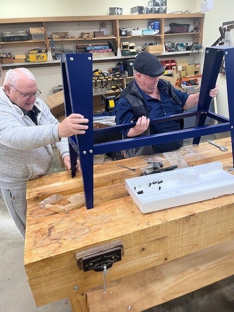 Group members of the Rochester Community House setting up the new equipment