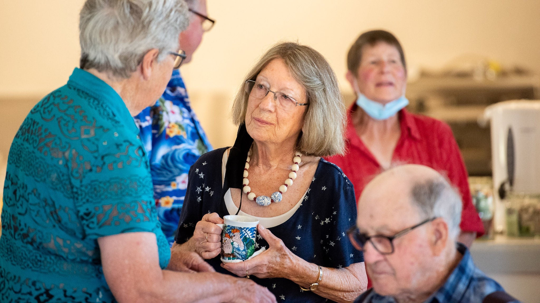 group of older people chatting talking cuppa masks budgeree