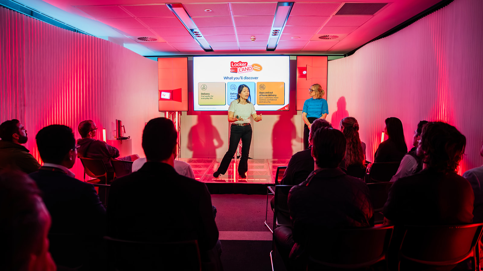 Two presenters sharing Parcel Locker insights with an audience at Locker Land.