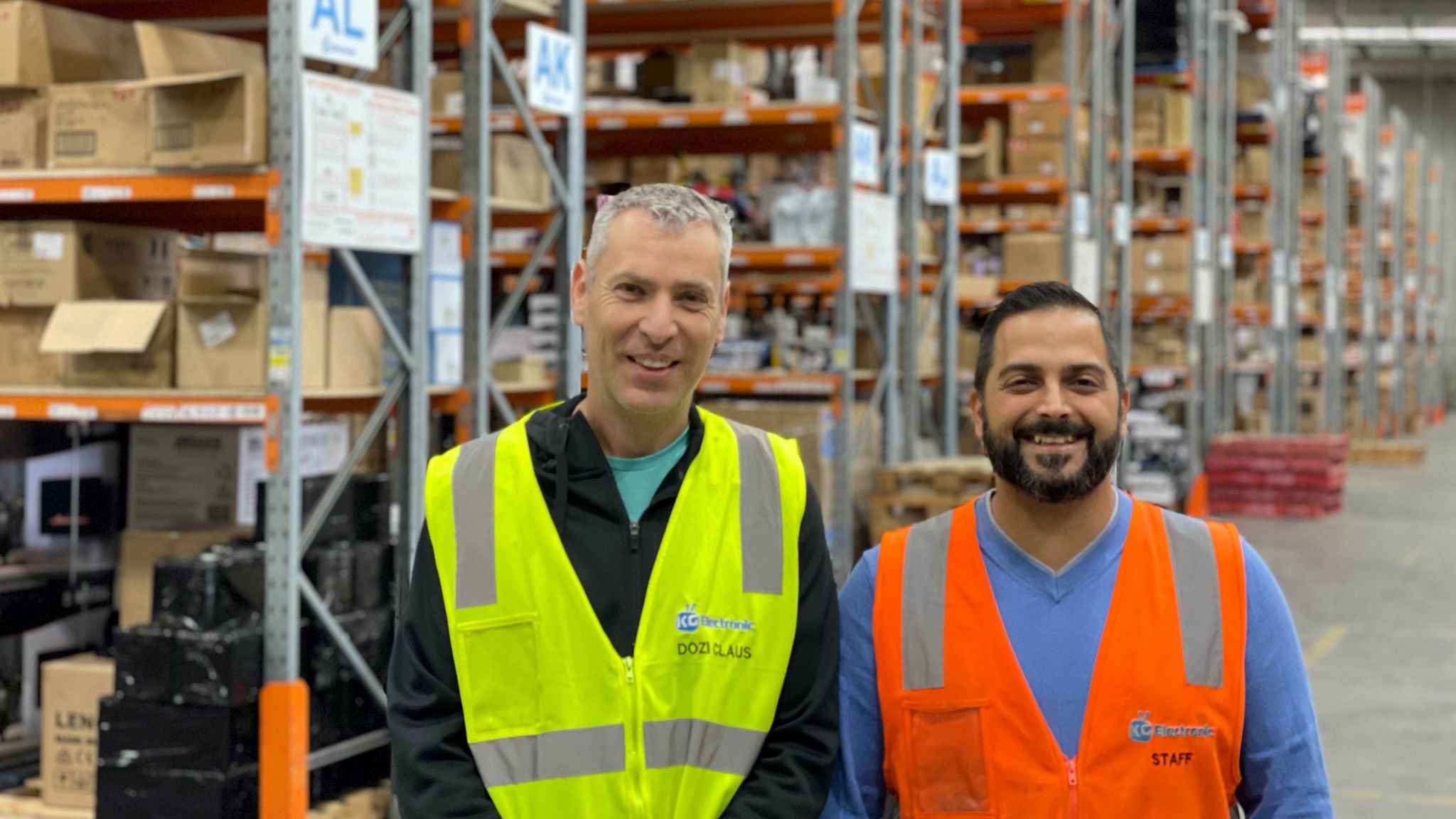 photo-two-men-wearing-hi-vis-in-warehouse-kg-group