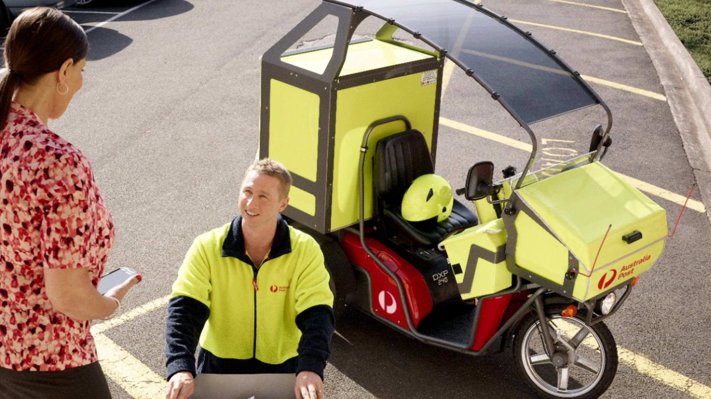 Postal delivery worker with electric tricycle vehicle  interacting with a woman