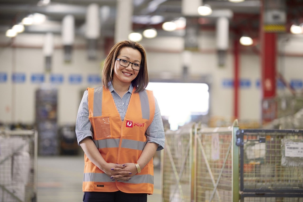 Female employee in parcel facility
