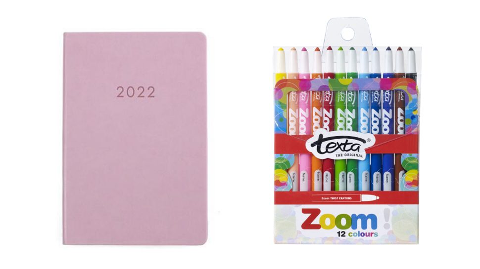 Pink diary with 2022 stamped on its cover and a pack of 12 crayons