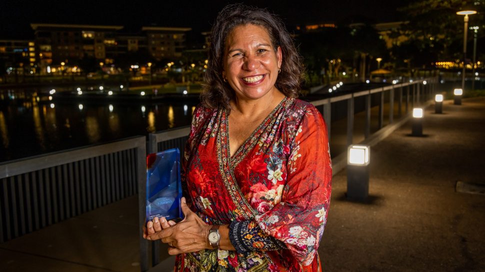 Leanne holding her 2022 Northern Territory Australian of the Year award. 
