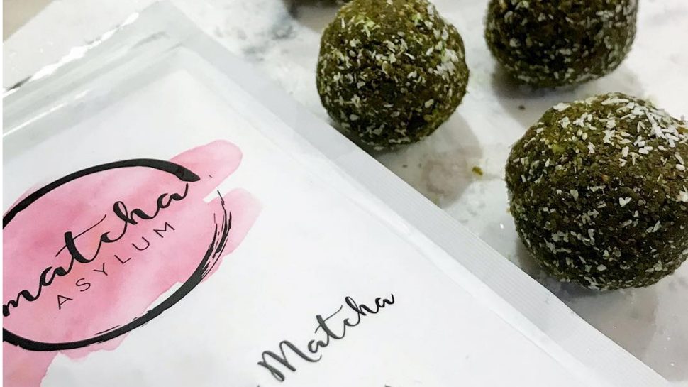 Matcha Asylum package next to green matcha protein balls