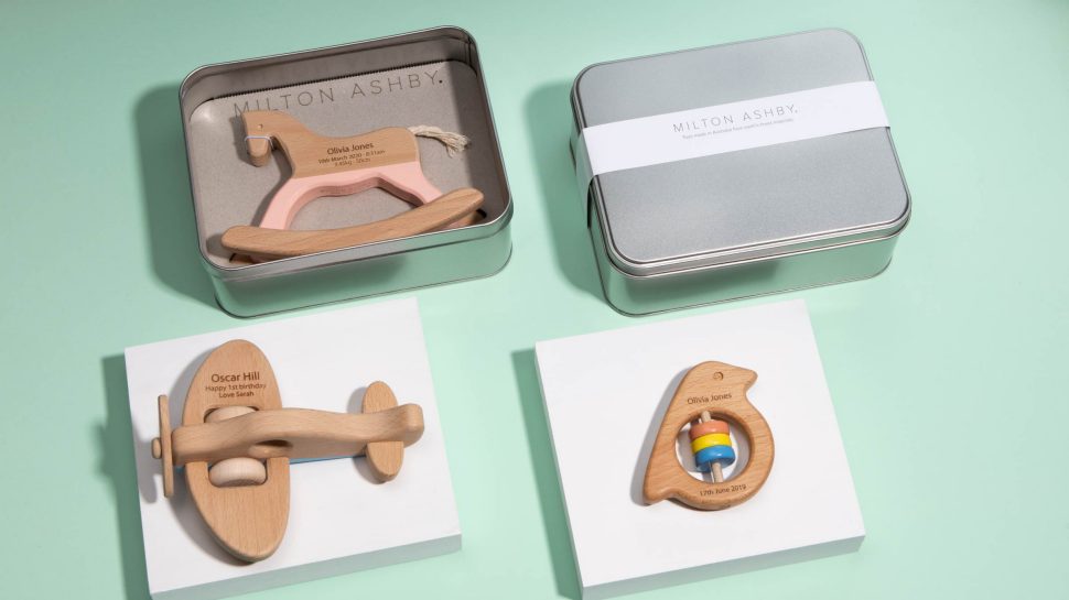 Wooden toys and gift box. Clockwise from top left - a rocking horse, a gift box, an aeroplane and a bird