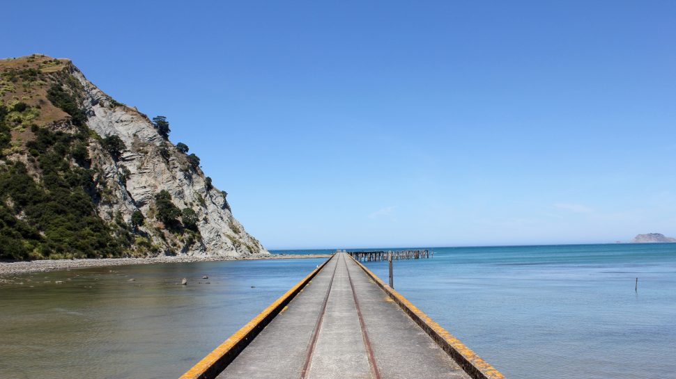 Jetty leading out to beach at Gisborne