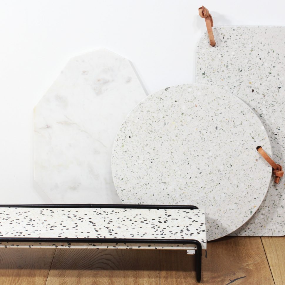 Close-up of chopping boards in a white and gray terrazzo design.