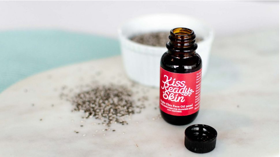 Open bottle of Kiss Ready oil with a bowl of chia seeds