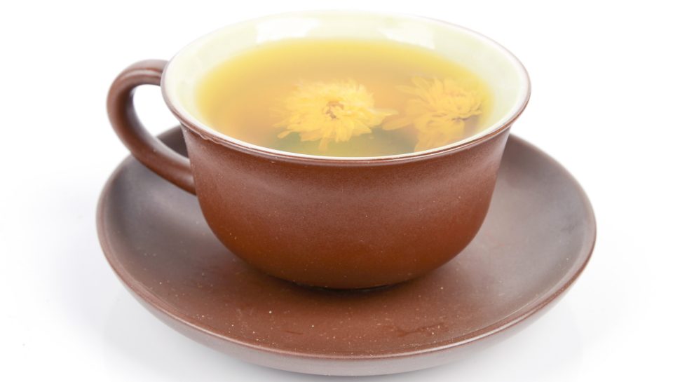 Brown cup and saucer of Chrysanthemum tea.  