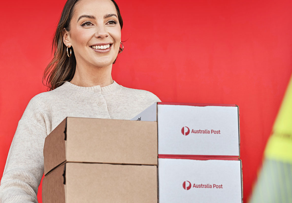 Female holding Australia post deliveries